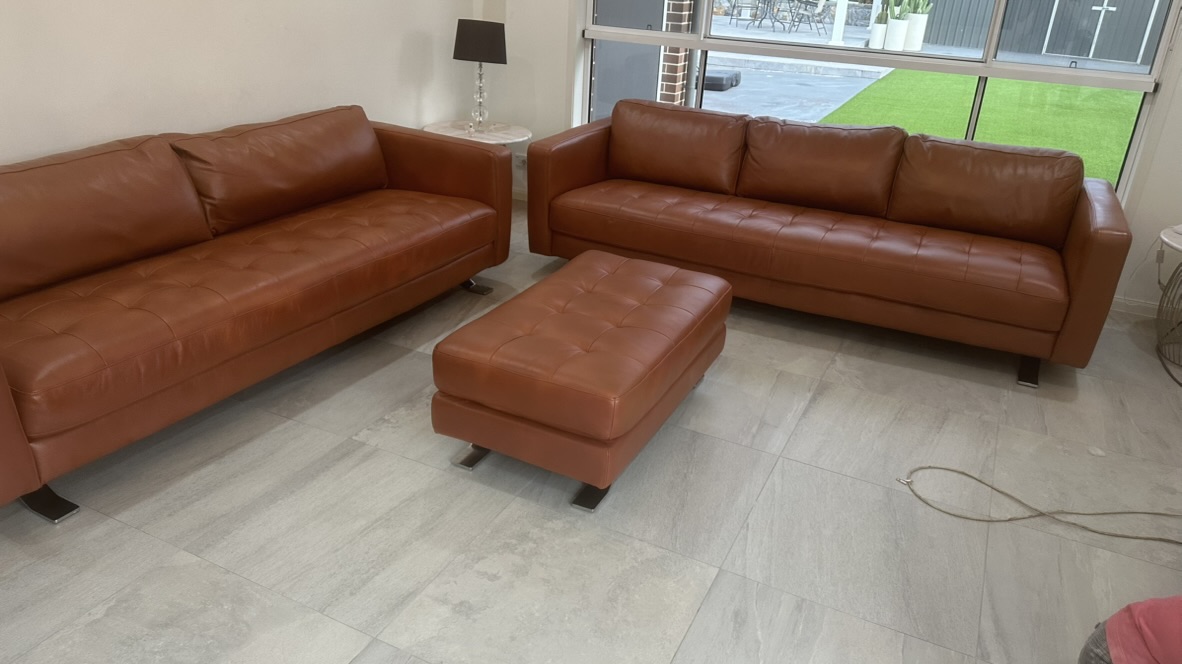 Complete tan leather suite after the owner-curated restoration sequence