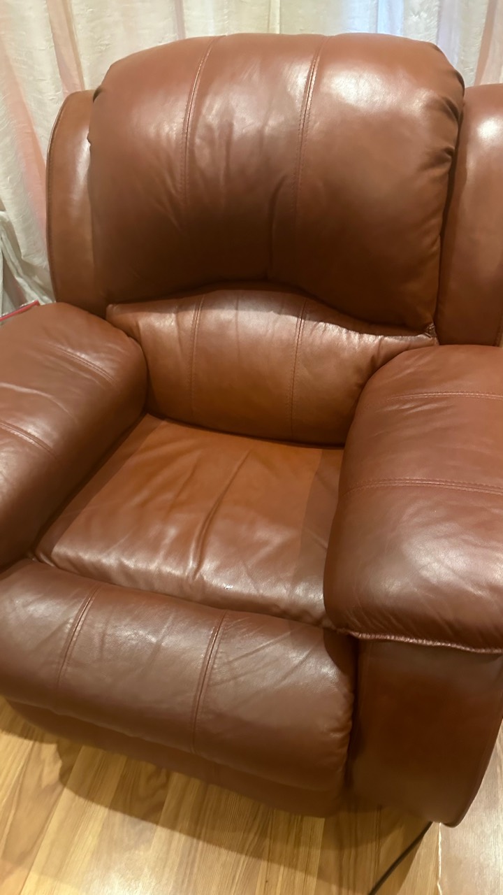 Brown leather recliner after the owner-supplied restoration sequence
