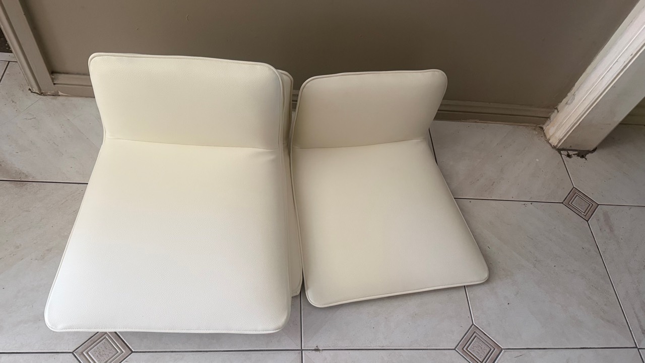 Two completed white upholstered seat and back cushion sets
